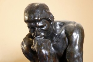 Sculpture of a person deep in thought.